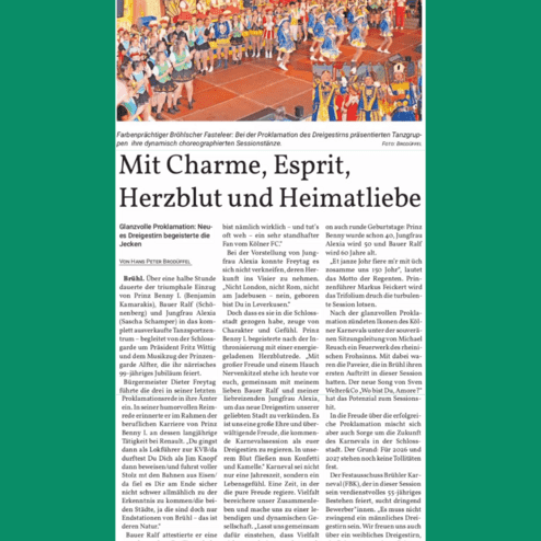 Bühnenszene mit tanzenden Gruppen in farbenfrohen Kostümen während der Proklamation des Dreigestirns in Brühl.