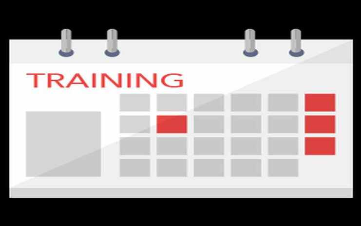 Kalenderblatt mit rotem Titel „TRAINING“ und hervorgehobenen Tagen in rot auf grauem Hintergrund.