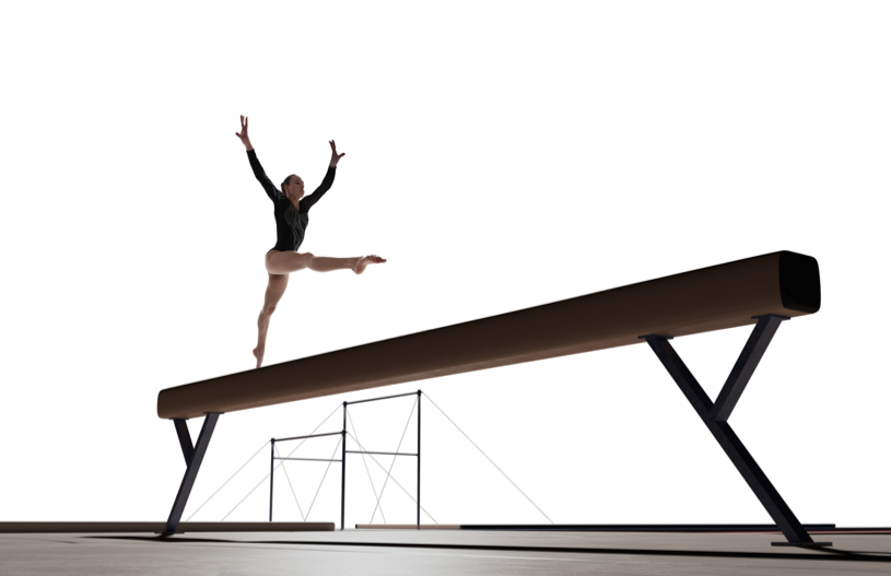 Akrobatin in schwarzem Outfit springt elegant von einem Balancebalken in einem hellen Trainingsraum.