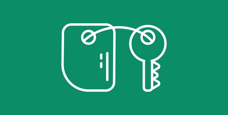 Symbol eines Schlüssels neben einem Schlüsselanhänger auf grünem Hintergrund.